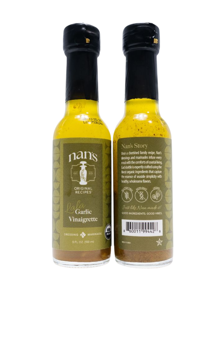 two mini bottles of Nan's lala garlic vinaigrette mini 5 oz bottle on a white background