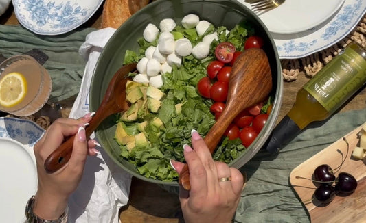 summer caprese salad on the picnic table with nan's lala garlic vinaigrette